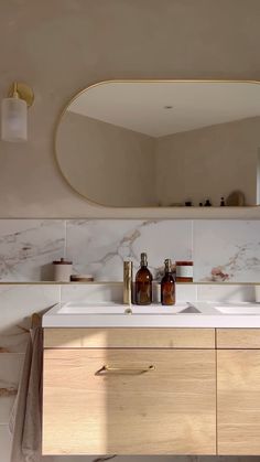 a bathroom with two sinks and a large mirror