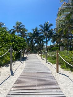 a wooden walkway leading to the beach