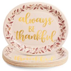 three white plates with gold lettering that says always be grateful on the front and back