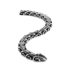 Maya is a striking and symbolic accessory that transcends ordinary style. This captivating piece, bathed in Antique Black, draws inspiration from the mystical symbolism of a serpent devouring its tail, creating an extraordinary blend of elegance and mystique. Hand-crafted with precise attention to detail, the Maya bracelet emulates the sinuous form of a snake, coiled intricately around the wrist. The Antique Black finish adds a touch of mystery and sophistication, making it a statement piece for Snake Coiled, Titanium Bracelet, A Snake, Bracelet For Men, Vintage Colors, Bracelet Sizes, Drake, Bracelets For Men, Cuff Bracelet