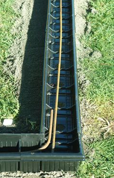 an overhead view of a train track with grass and dirt on the ground next to it