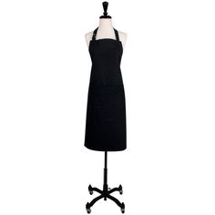 a black apron on a mannequin with wheels