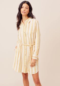 Our new long sleeve, collared button down shirt dress in beachy yellow and white stripes will have heads turning! Featuring a trending rope belt detail and button cuff wrists. The new striped Justine Shirt Dress can take you from work to the beach with its lightweight, 100% cotton fabrication. FINAL SALE Yellow and white stripe Relaxed fit Long sleeve Hits above the knee Classic collar Single front pocket Beach dress Model is 5'9, wearing a size S.Style: I-71812W-QXB Yellow Striped Shirt, Yellow Striped Dress, Rope Belt, Button Down Shirt Dress, Cotton Shirt Dress, Striped Shirt Dress, Stripe Shirt, Striped Tie, Yellow Stripes