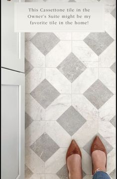 a woman's feet standing in front of a tile floor with the words, this gasettoe tile in the owner's suite might be my favorite life in the home?