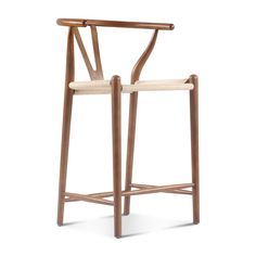 the wish bar stool is made from solid wood and upholstered with woven seat padding