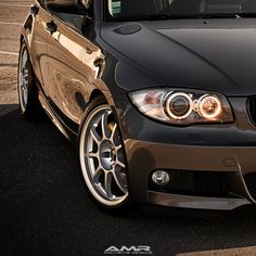 the front end of a bmw car parked in a parking lot