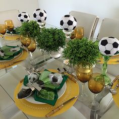 the table is set with soccer themed place settings