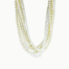 A glistening iridescence is the highlight of this one-of-a-kind, can't-miss multi-layered necklace. Satin ribbons, clear crystals, and white pearls in graduating sizes combine for a sartorial showstopper. Use the smooth ribbons to freshly fashion a short, medium, or long layered look - sophisticated and feminine - perfect for that special evening out! Fresh Water Cultured Pearls Pearl: Love - Beauty - Wealth Colors: Dove, Peach and Ivory Metal: Sterling Silver Length: 18" - 32" Adjustable Multi-strand Pearl Chain Necklace For Party, Multi-strand Pearl White Pearl Necklace For Party, White Multi-strand Pearl Necklace For Party, Multi-strand White Pearl Necklace For Parties, White Multi-strand Pearl Necklace, White Multi-strand Pearl Chain Necklace, Party Multi-strand White Pearl Necklace, White Multi-strand Beaded Necklace With Pearl Drop, Cream Pearl Multi-strand Necklace