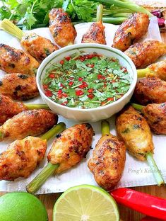 chicken wings with cilantro and salsa on the side