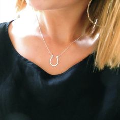 A sterling silver horseshoe is suspended by a sparkling sterling silver chain. The pendant is hand shaped, hammered, and polished to a glittering finish. The hammered surface of the horseshoe gives it a gorgeous organic appearance that allows it to reflect light from any angle.  The horseshoe is made from tarnish resistant sterling silver so minimal cleaning is required.This necklace is made of high quality materials. We only use 14k gold filled and rose gold filled, which (unlike gold plate) wi Silver Horseshoe Necklace, Good Luck Horseshoe, Luck Necklace, Good Luck Necklace, Horseshoe Pendant, Horseshoe Necklace, Handmade Sterling Silver, Sterling Silver Chain, Rose Cut