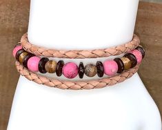 "This one of a kind bracelet is made from memory wire and 4mm  tan braided leather, adorned with pink jasper beads, brown picture jasper beads, coconut shell beads and antique bronze metal spacers with a \"made with love\" charm. Bracelet is made of memory wire and will fit all wrist sizes.   I invite you to come on in and browse my shop's entire selection of handcrafted jewelry! https://www.etsy.com/shop/BeauFaireCreations" Adjustable Pink Leather Jewelry, Brown Beaded Leather Bracelet, Unique Brown Beaded Leather Bracelet, Adjustable Brown Leather Bracelet With Natural Stones, Brown Leather Bracelet With Natural Stones In Spiritual Style, Handmade Southwestern Brown Leather Bracelet, Spiritual Brown Leather Bracelet With Natural Stones, Unique Brown Wrap Bracelet With Round Beads, Adjustable Hand-strung Brown Leather Bracelet