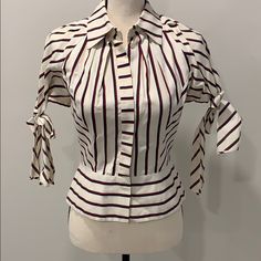 Red/White/Blue Striped Blouse With Puffed Sleeves Bow Ties On Sleeves Bottom Front Collared Shirt With Flare At Waist Made In Italy Retro Striped Collared Blouse, White Button-up Top With Contrast Stripes, Cotton Button-up Top With Contrast Stripes, Striped Button-up Blouse With Button Closure, Blue Striped Blouse, Blue Vertical Stripes Button-up Blouse, Antonio Marras, Striped Blouse, Red White Blue