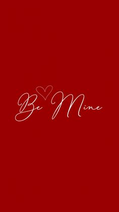 the word be mine written in white ink on a red background with a small heart