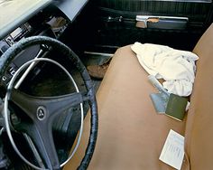 the interior of an old car with no one in it