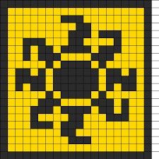 a yellow and black square with an image of a smiley face on it's side