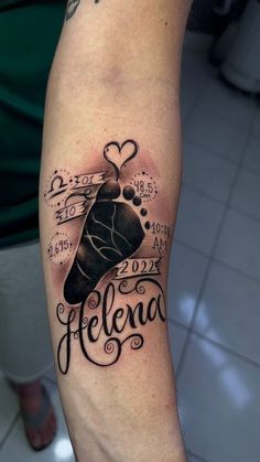 a person with a tattoo on their arm that says, felecia and has an image of a bell