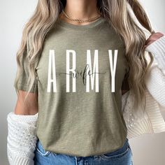 Army wife sweatshirt/crewneck! This will be perfect for engagement gift/Deployment Gifts/graduation gift, holiday gift, etc... This classic unisex jersey short sleeve tee fits like a well-loved favorite. Soft cotton and quality print make users fall in love with it over and over again. These t-shirts have-ribbed knit collars to bolster shaping. The shoulders have taping for better fit over time. Dual side seams hold the garment's shape for longer.  .: 100% Airlume combed and ringspun cotton (fib Army Wife Shirts, Army Graduation Outfit, Army Wife Tattoos, Army Graduation Gifts, Army Graduation, Homemade Shirts, Wife Sweatshirt, Army Wife Life, Army Mom Shirts