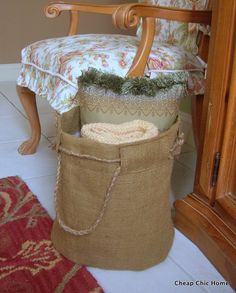 a chair that is sitting next to a bag on the floor with some stuff in it