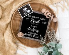 a sign that says we can't wait to meet you baby jackson on it