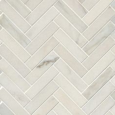 white marble herringbone pattern tile on the floor