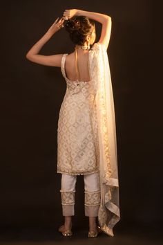 White sleeveless kurta with checkered brocade woven motifs and pearl embellished drops on hem. Paired with straight pant and border woven sheer dupatta. - Aza Fashions Elegant Sleeveless Semi-stitched Kurta, Elegant Sleeveless Salwar Kameez With Dupatta, Elegant Sleeveless Kurta With Dupatta, Elegant Sleeveless Traditional Wear With Dupatta, Fitted Sleeveless Chanderi Kurta, Elegant Sleeveless Designer Kurta, Elegant Sleeveless Designer Traditional Wear, Unstitched Elegant Sleeveless Kurta, Fitted Traditional Wear With Woven Motifs For Eid