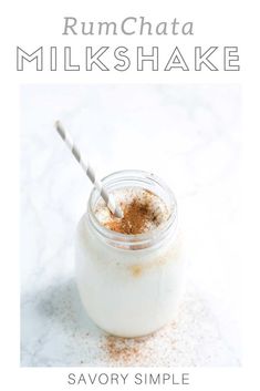 a glass jar filled with some kind of drink on top of a white countertop