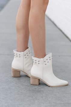 Crafted with ivory leather, these STUDDDED STEPS BOOTS add a touch of edginess to any outfit. The studded detailing on the sides and heels give these boots a unique and stylish look. With a sturdy sole and comfortable fit, these boots will keep you walking in style all day long. Studded High Heel Boots For Spring, High Heel Studded Boots For Spring, High Heel Studded Spring Boots, Spring High Heel Boots With Studs, Chic High Heel Boots With Silver Studs, Ankle Boots With Silver Studs For Fall, Fall Ankle Boots With Gold Studs, Gold Studded Ankle Boots For Fall, Chic Spiked Ankle Boots