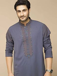 <ul> <li>Color: Light slate gray</li> <li>Prominent-looking kurta features embroidery detail on collar, sleeves, around placket and placket</li> <li>Complemented with matching shalwar</li> </ul> <p><br /><br /><strong>Additional Accessories:</strong><br />Peshawari Sandal: <strong>US$50</strong><br />Men's Shawl: <strong>US$50</strong></p> Gray Traditional Wear For Eid, Traditional Gray Wear For Eid, Festive Gray Long Sleeve Sets, Traditional Gray Kurta For Eid, Traditional Gray Embroidered Sets, Semi-formal Long Sleeve Embroidered Kurta, Gray Cotton Kurta For Eid, Semi-formal Cotton Traditional Wear With Long Sleeves, Cotton Traditional Wear For Semi-formal Occasions