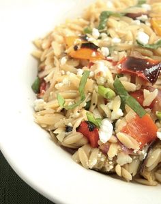 a white bowl filled with rice and vegetables