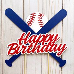 a happy birthday cake topper with baseballs and bats on it's stick