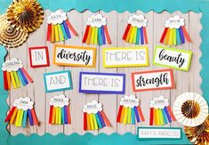 a bulletin board with rainbows and words on it that says, in diversity there is strength