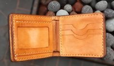 "Tooled billfold roper cowboy biker wallet hand carved Sheridan western style. The outer is made from 8-9 oz. vegetable tanned leather*. It is dyed, covered with a special compound** to protect against moisture, and finished with a clear gloss giving it a lasting shine. 9 1/2\" x 4\" You can customize dimensions before ordering The interior has 3 credit card compartments, 1 ID, 2 billfold compartments, 1 full length bill compartment. Tooled billfold wallet hand carved leather Sheridan style is h Custom Hand Tooled Leather Trifold Wallet, Artisan Hand Tooled Leather Trifold Wallet, Vegetable Leather, Biker Wallet, Billfold Wallet, Clear Gloss, Cane Corso, Saint Paul, Vegetable Tanned Leather