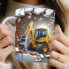 a woman holding up a coffee mug with a construction vehicle on it and breaking through the background