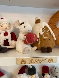 several stuffed animals are sitting on the shelf