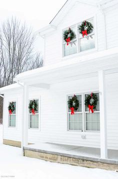 the instagram page for instagram is displayed in front of a white house with wreaths on it