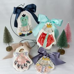 three ceramic ornaments are sitting next to each other