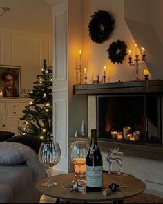 a living room filled with furniture next to a christmas tree