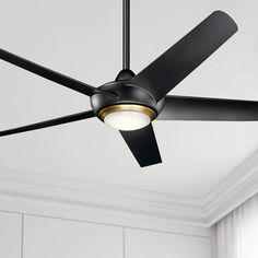 a ceiling fan in a room with white walls and black ceiling fans on the ceiling