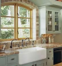 a kitchen with an oven, sink and cabinets