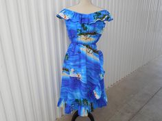 Hawaiian Dress Casual Wear Hawaii USA Size M Medium Cobalt Turquoise Ocean Blue Beach Island Palm Tree Sailboat Ocean Ruffle Shoulder Style.  The Maker's Mark and size is featured as seen in photo number ten 10.  It is stated as Imported Fabric and is Machine Washable. Measurements Marked Size M Medium **All Measurements Taken Flat Lay On Front Of Dress 36 inches in length measuring from the center scoop neck station down the center of the dress to the base hem stations 12 inches in width measur Beachy Blue Dresses With Tropical Print, Blue Beachy Vacation Dresses, Blue Tropical Print Dress For Vacation, Blue Tropical Print Vacation Dress, Blue Hawaiian Vacation Dress, Blue Hawaiian Dress With Tropical Print, Blue Fitted Hawaiian Dress, Turquoise Ocean, Hawaii Usa