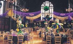 tables and chairs are set up for a mardi gras party with purple decorations