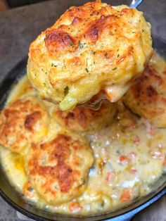 a close up of food on a plate with broccoli and cheese in it