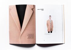 an open magazine with a man in a pink coat