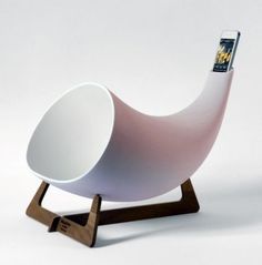 a white chair with a magazine holder on it