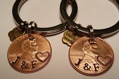 two personalized keychains with one penny and the other is an american eagle