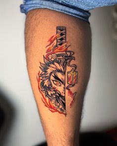 a man's leg with a tattoo on it that has an image of a wolf