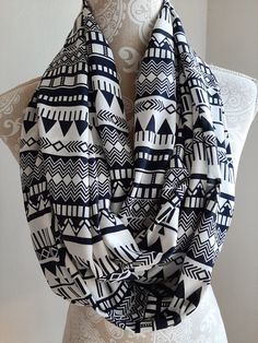 Black and white tribal infinity scarf, southwestern print scarf, scarves for women, scarf women's,tribal print scarf, infinity scarves Spice up your look with some southwestern flair. You will love this black and white infinity scarf. This scarf has a cute tribal print that is very trendy. Lovely light weight scarf can dress up any outfit.  Great with any outfit whether it is casual or dressy.  Super soft fabric will feel good around your neck. This stylish scarf is the perfect touch for any eve White Bohemian Scarf One Size, Bohemian Infinity Loop Scarf, White Infinity, Scarf Infinity, Southwestern Print, Stylish Scarves, Infinity Scarves, Women Scarf, Lightweight Scarf