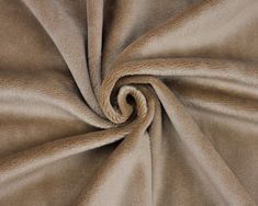 a close up view of a tan fabric