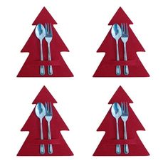 four forks and spoons in the shape of christmas trees on red placemats