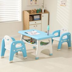 a child's table and chairs in a room